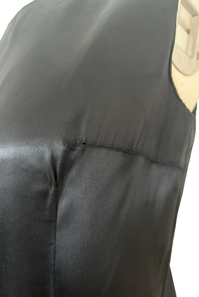 Front detail view of 1960s does 1920s vintage black satin and lace flapper dress costume, small to medium. Showing a little fraying at one of the bust darts.