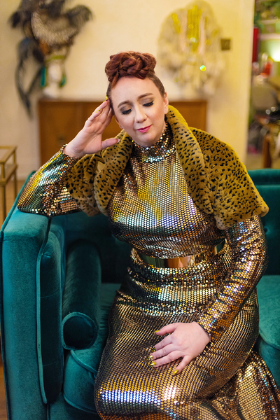 The Leslie Courreges Anita Bolero features recessed leopard spots against golden faux fur.
