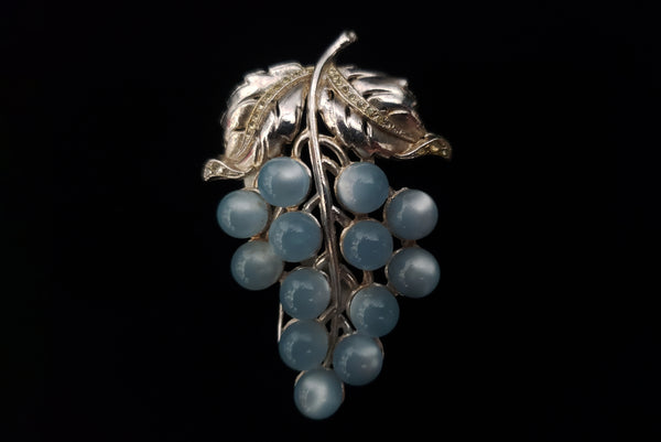 1930s Vintage Silver Tone, Rhinestone, and Pale Blue Moonglow Bunch of Grapes Fur Clip