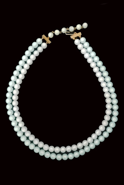 Vertical view of 1960s vintage double strand moonglow Lucite two tone blue adjustable necklace.