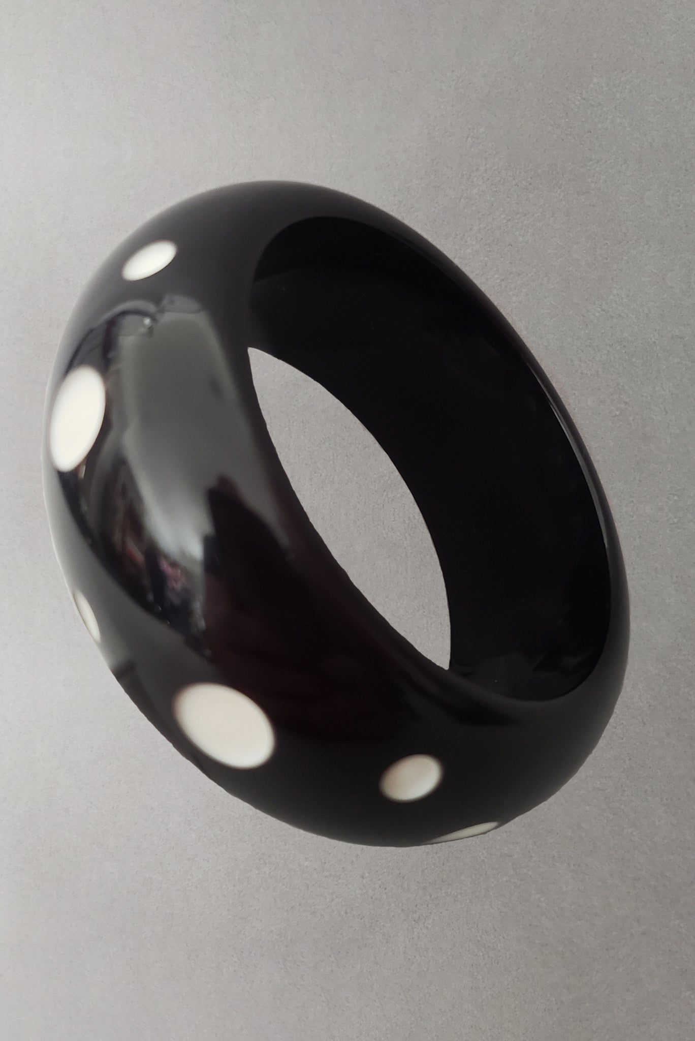 1960s Vintage Wide Lucite Black and White Carved Dot Cut Through Bangle Bracelet