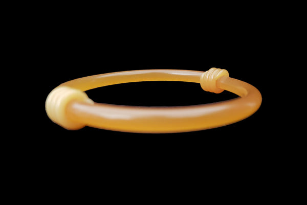 Horizontal front view of 1960s vintage translucent mustard yellow plastic tube bangle bracelet with wrapped phone cord detailing.