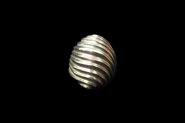 Horizontal front view of 1980s vintage 925 sterling silver modernist wavy groove dome ring, size 8.25.