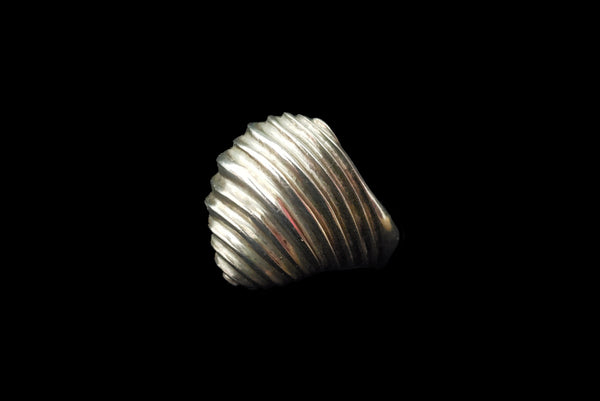 Horizontal side view of 1980s vintage 925 sterling silver modernist wavy groove dome ring, size 8.25.
