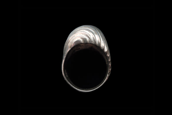 Horizontal top view of 1980s vintage 925 sterling silver modernist wavy groove dome ring, size 8.25.