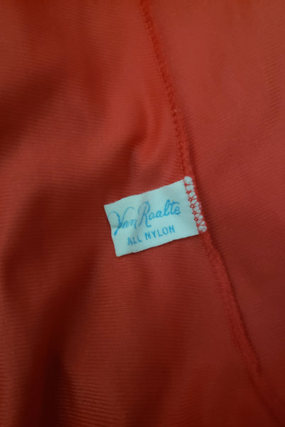 Interior detail view of 1950s vintage crimson red nylon and lace full slip by Van Raalte, small to medium. Showing the Van Raalte label.