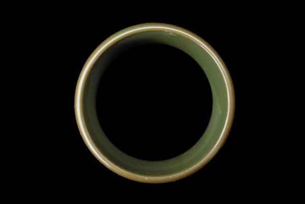 Horizontal top view of 1930s vintage green floral carved Bakelite bangle bracelet.