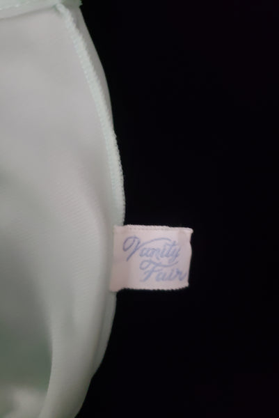 Interior detail view of 1940s vintage pale aqua blue lace, nylon, and satin ribbon ballerina nightgown by Vanity Fair, small to medium. Showing the Vanity Fair label.
