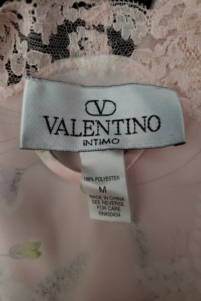 Interior detail view of 1980s vintage lace trimmed pink floral satin robe by Valentino Intimo, small, medium, large. Showing the Valentino Intimo label, the size M & fabric care tag.