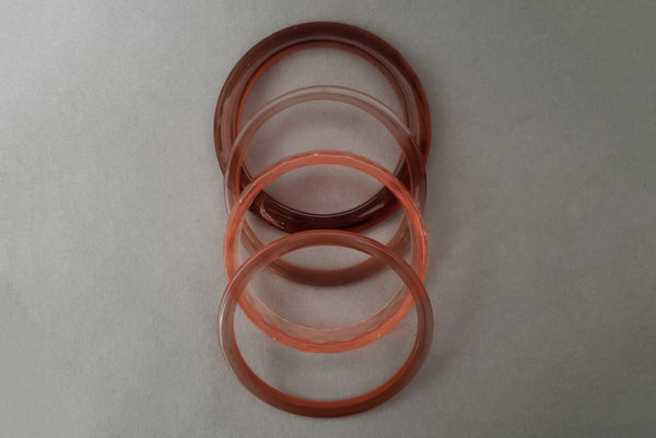 1980s Vintage Translucent Peach and Brown Four (4) Bangle Bracelet Set