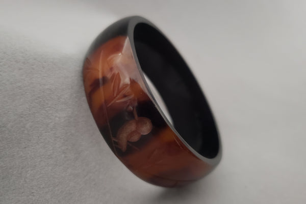 1940s Marbled Butterscotch and Brown Carved Black Overdyed Bird Bakelite Bangle