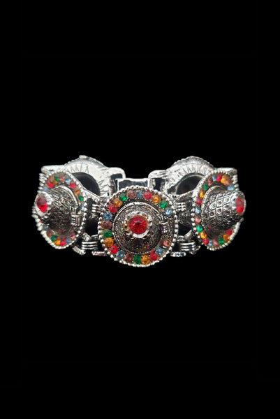 Vertical front view of 1960s vintage blue, green, orange, red, and purple multicolor rhinestone silver tone sombrero hat bracelet by PA.