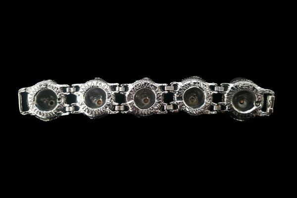 Horizontal back view of 1960s vintage blue, green, orange, red, and purple multicolor rhinestone silver tone sombrero hat bracelet by PA.