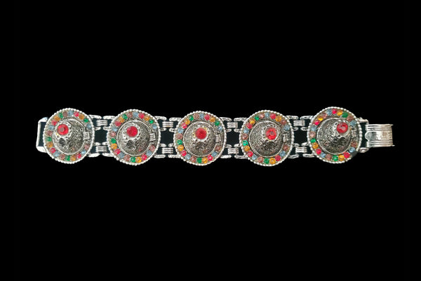 Horizontal front view of 1960s vintage blue, green, orange, red, and purple multicolor rhinestone silver tone sombrero hat bracelet by PA.