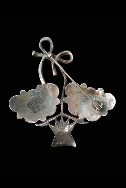 Vertical back view of 1920s vintage 925 sterling silver modernist flower basket brooch.