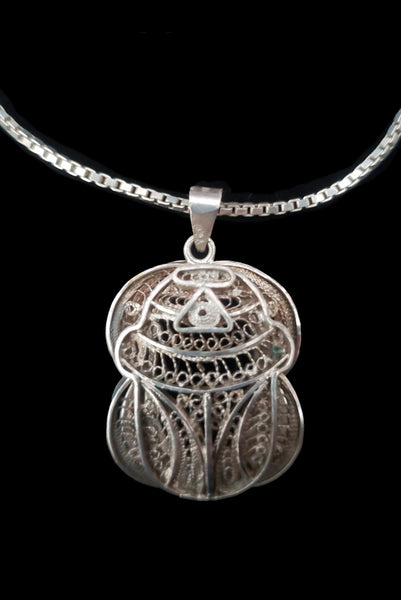 Detail front view of 1970s vintage silver filigree Egyptian scarab insect pendant on matching box chain.