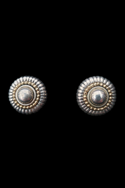 Vertical front view of 1990s vintage Flli Menegatti 925 sterling silver and 14k gold round fluted tow-tone clip-on earrings.