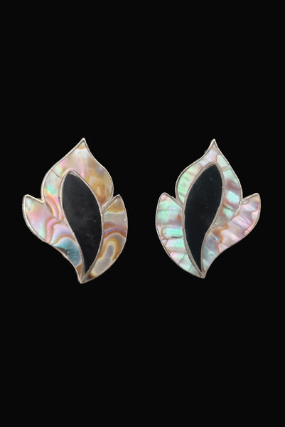 Vertical front view of 1950s vintage inlaid abalone & onyx flame and 925 sterling silver screw back earrings.