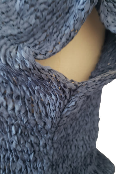 Detail view of 1950s vintage periwinkle rayon ribbon crochet dress, medium to extra large. Showing slight yellowing at the underarm.