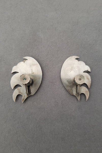 Vertical back view of 1940s vintage 925 sterling silver feather fan screw back earrings.
