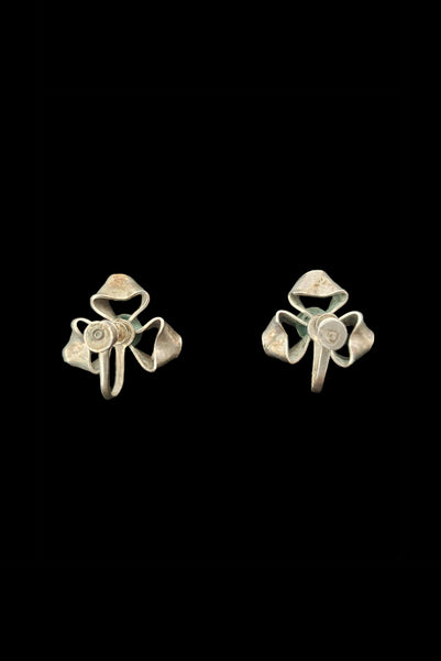 Vertical back view of 1940s vintage 925 sterling silver triple loop ribbon screw back earrings.