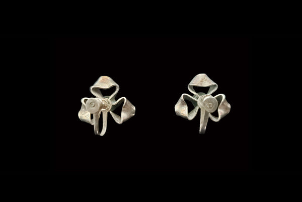 Horizontal back view of 1940s vintage 925 sterling silver triple loop ribbon screw back earrings.