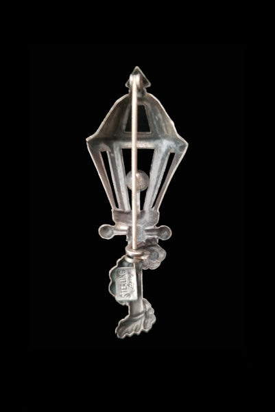 Vertical back view of 1950s vintage 925 sterling silver and orange rhinestone lamppost brooch by Lang.