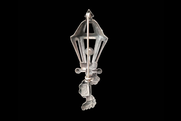 Horizontal back view of 1950s vintage 925 sterling silver and orange rhinestone lamppost brooch by Lang.