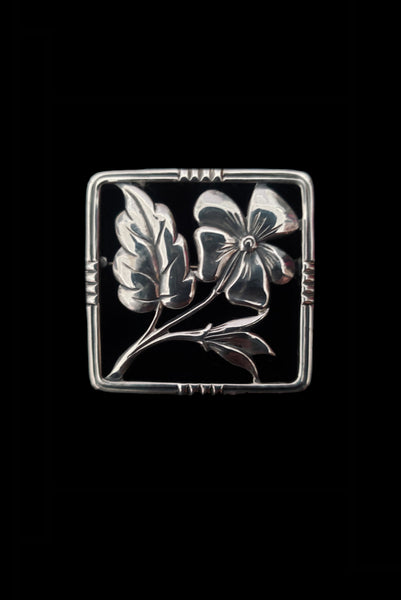 Vertical front view of 1950s vintage 925 sterling silver square flower brooch.