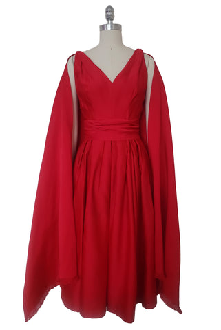Front view of 1960s vintage red duchess satin low back, wrapped waist, pleated skirt cocktail dress with shawl by Rappi, extra extra small to extra small.