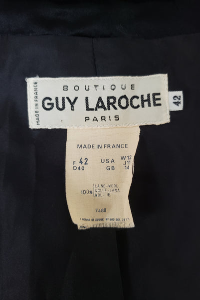 Interior detail view of 1980s vintage black wool and satin puff sleeve asymmetrical tuxedo style jacket by Guy Laroche, medium to large. Showing the designer Guy Larouche label, and the size 42 tag.