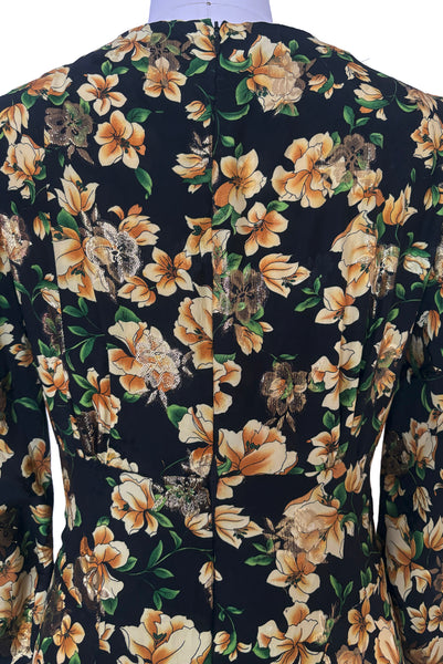 Detail view of vintage 2000s made 1940s reproduction black, yellow, and gold floral silk and lurex evening dress, size medium to large. Showing the invisible zipper at center back.