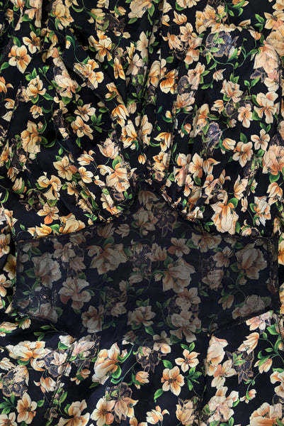 Interior detail view of vintage 2000s made 1940s reproduction black, yellow, and gold floral silk and lurex evening dress, size medium to large. Showing the black silk organza underlining at the midriff.