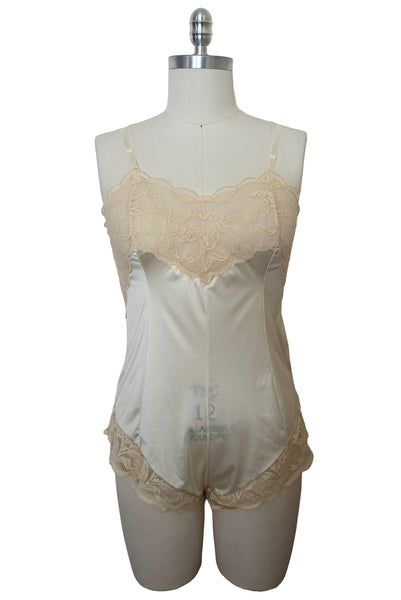 Front view of 1980s vintage cream nylon tricot and floral lace sweetheart neckline teddy/bodysuit, by Wonder Maid, size small to medium.