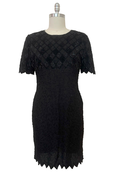 Front view of 1980s vintage diamonds black beaded and sequin silk chiffon crew neck, short sleeve, fitted knee length cocktail dress by Laurence Kazar, size medium to large.