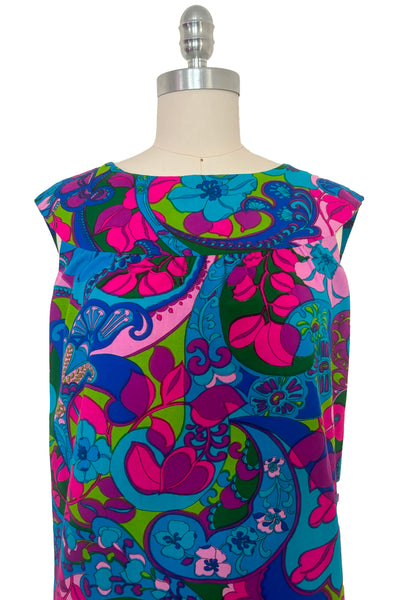 Bodice front view of vintage 1960s blue, pink, purple, and green psychedelic floral print cotton shift dress, extra small to small.