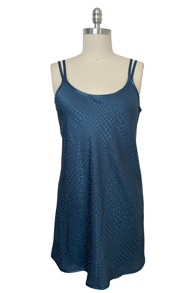 Front view of 1990s vintage dusty blue polyester jacquard satin bias cut short slip nightgown by Jones New York, size medium to large.