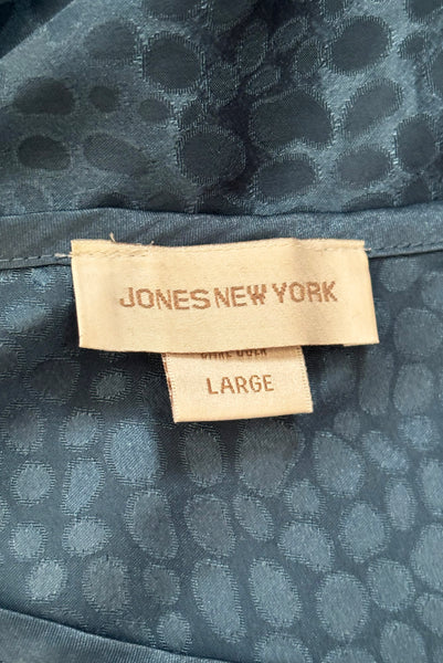 Interior detail view of 1990s vintage dusty blue polyester jacquard satin bias cut short slip nightgown by Jones New York, size medium to large. Showing the Jones New York label and size Large tag.