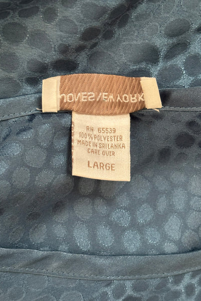 Interior detail view of 1990s vintage dusty blue polyester jacquard satin bias cut short slip nightgown by Jones New York, size medium to large. Showing the 100% polyester and size Large tag.