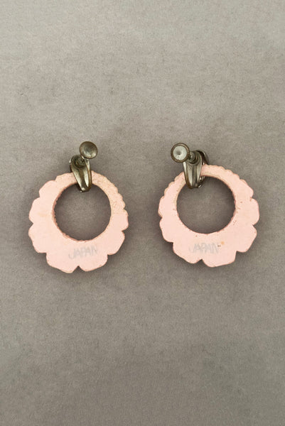 Vertical back view of 30s vintage pink floral carved celluloid and rhinestone silver tone screw back hoop earrings.
