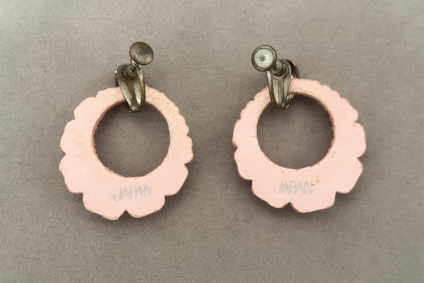 Horizontal back view of 30s vintage pink floral carved celluloid and rhinestone silver tone screw back hoop earrings.