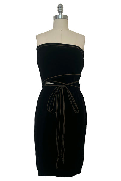 Front view of 1970s vintage rare designer Holly's Harp black velvet, gold metal cord trimmed wrap top & skirt set, extra small to small. Showing a different way to wrap the top.