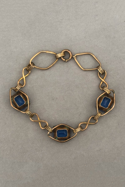 Vertical back view of 1930s vintage Art Deco blue rhinestone and 12kt gold fill link bracelet.