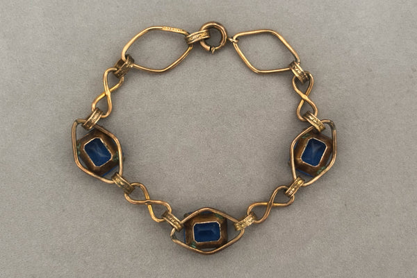 Horizontal back view of 1930s vintage Art Deco blue rhinestone and 12kt gold fill link bracelet.
