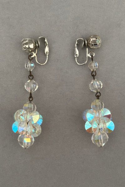 Vertical side view of 1960s vintage iridescent crystal beaded drop clip-on earrings.