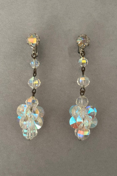 Vertical front view of 1960s vintage iridescent crystal beaded drop clip-on earrings.