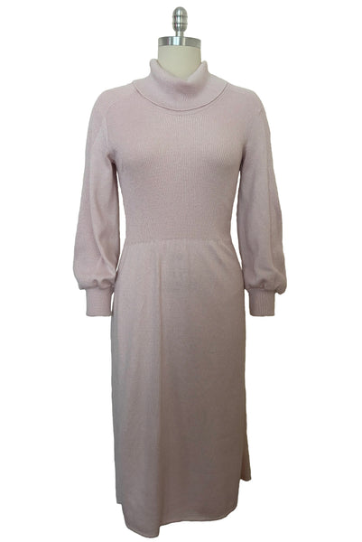 Front view of 1970s vintage blush pink turtleneck bishop sleeve acrylic polyester nylon blend sweater dress by JT Martin, size medium to large.