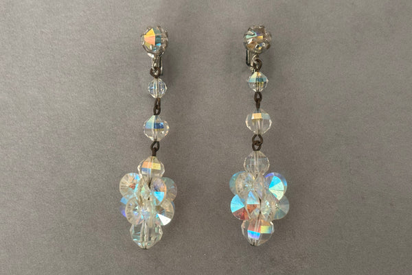 Horizontal front view of 1960s vintage iridescent crystal beaded drop clip-on earrings.