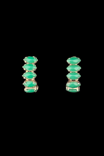 Vertical front view of 1950s vintage green marquise cabochon gold tone clip -on hoop earrings.