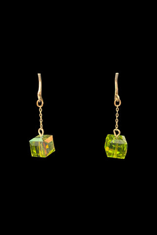 Vertical front view of 1960s vintage square green iridescent crystal bead and gold tone chain link drop faux pierced clip-on earrings.